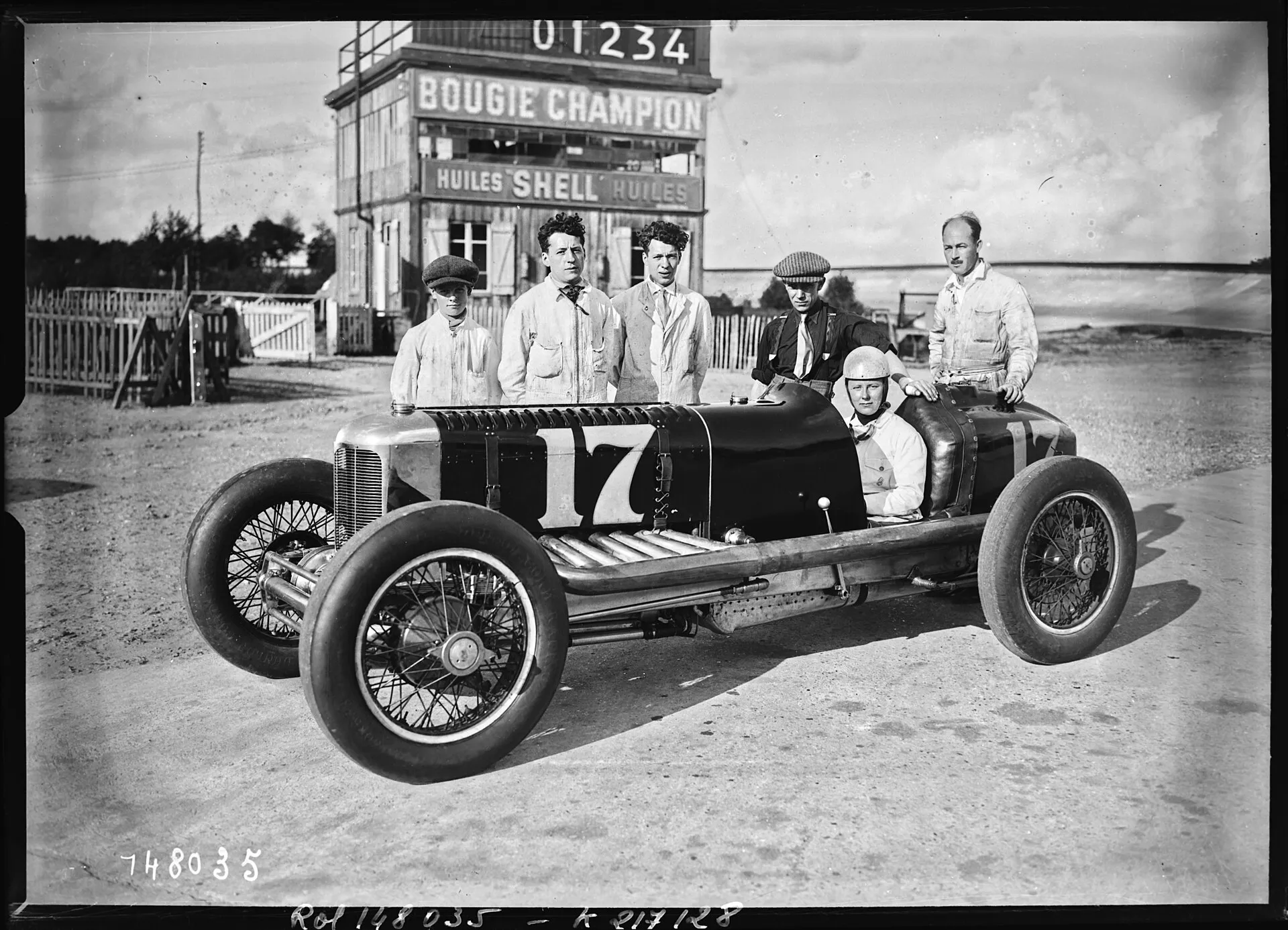 A black-and-white photograph of Gwenda Stewart seated in a Derby-Miller racing car at Montlhéry, July 1930