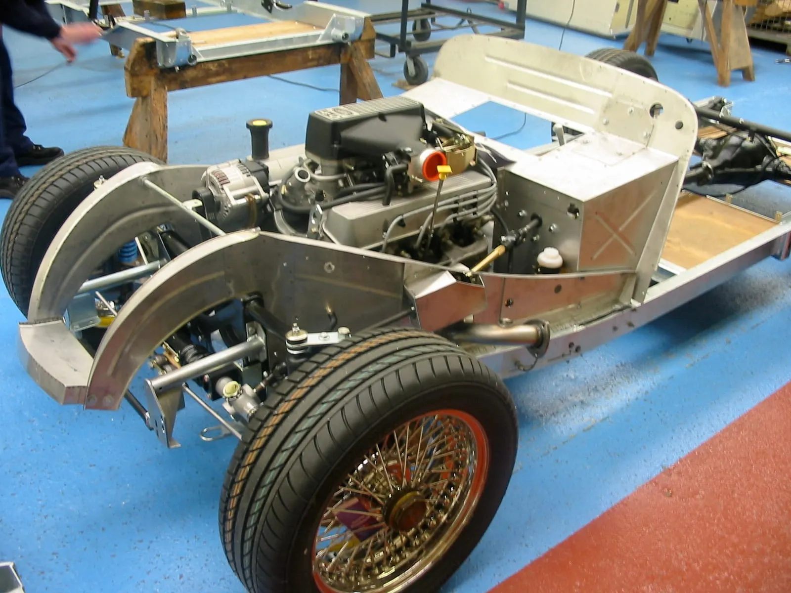 A Rover V8 engine in a Plus 8 chassis, with wire wheels and aluminium bulkhead